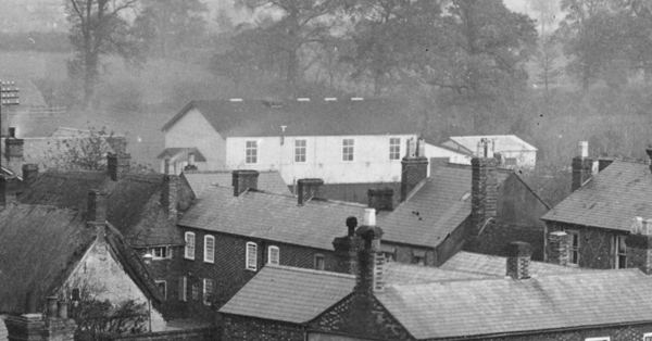 Gymnasium seen beyond High Street buildings